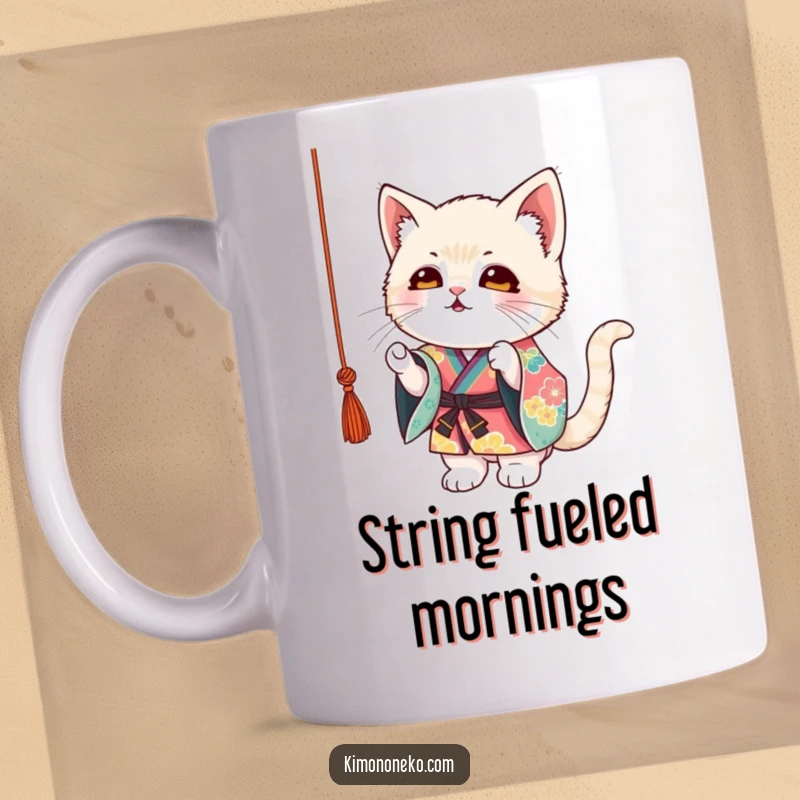 Funny Kitten Kimono Mug: A mischievous kitten in a colorful kimono playfully batting at a dangling string, full of fun.