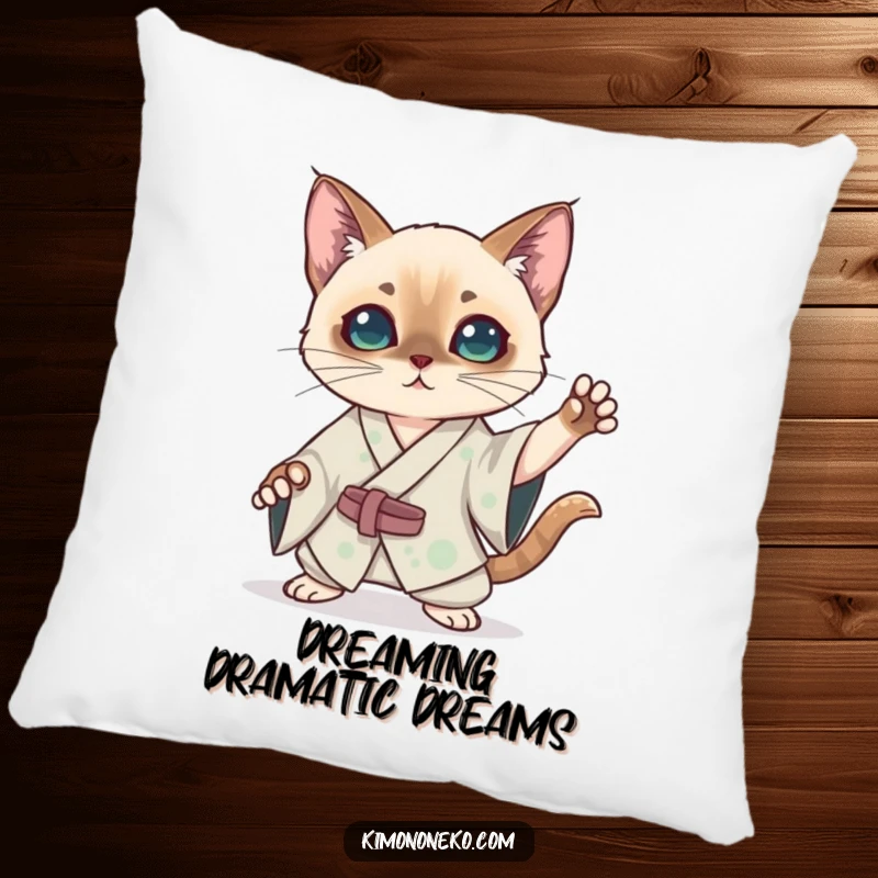 Funny kawaii Siamese cat in a silk kimono striking a dramatic pose on a plush pillow, offering humorous anime-inspired drama and comfort.