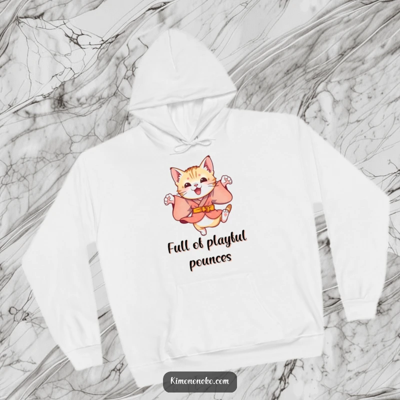 Funny hooded sweatshirt showcasing a playful kitten in a colorful kimono, doing energetic leaps, perfect for cozy, fun-filled moments.