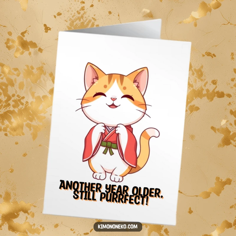 Free Printable Birthday Card: A happy kawaii calico cat in a red kimono performs a graceful bow.
