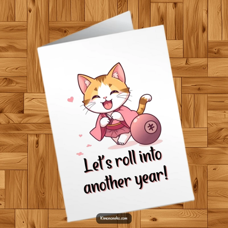 Funny Free Printable Birthday Card with a kawaii calico cat in a pink kimono excitedly chasing a rolling ball, full of playful energy.