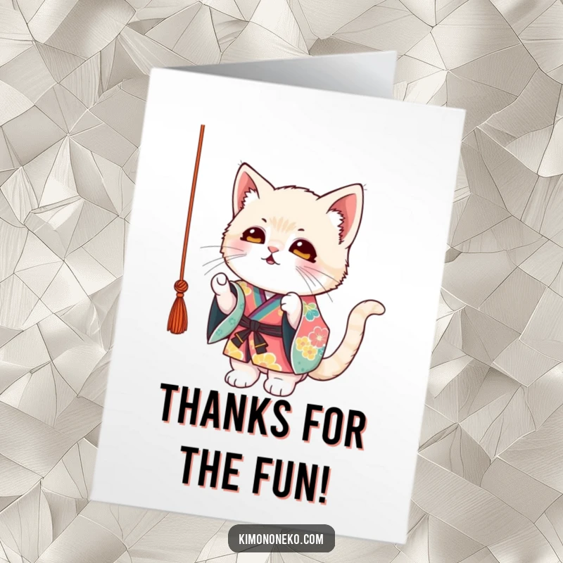 Funny Free Printable Thank You Card: Mischievous kitten in a colorful kimono playfully batting at a string, expressing gratitude.