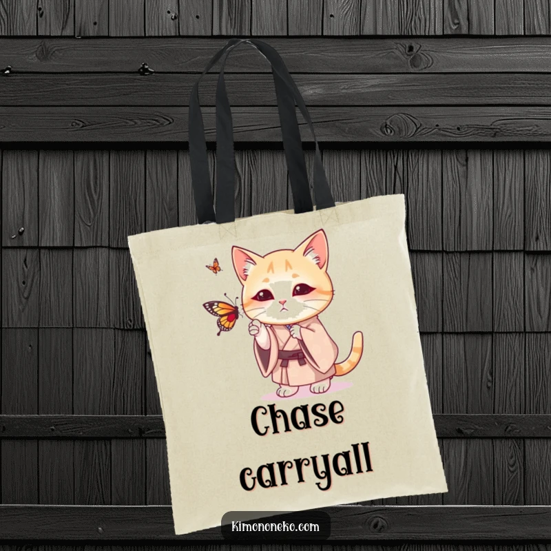 Funny tote bag with a cat wearing a patterned kimono, humorously attempting to bat at a butterfly with playful intent.